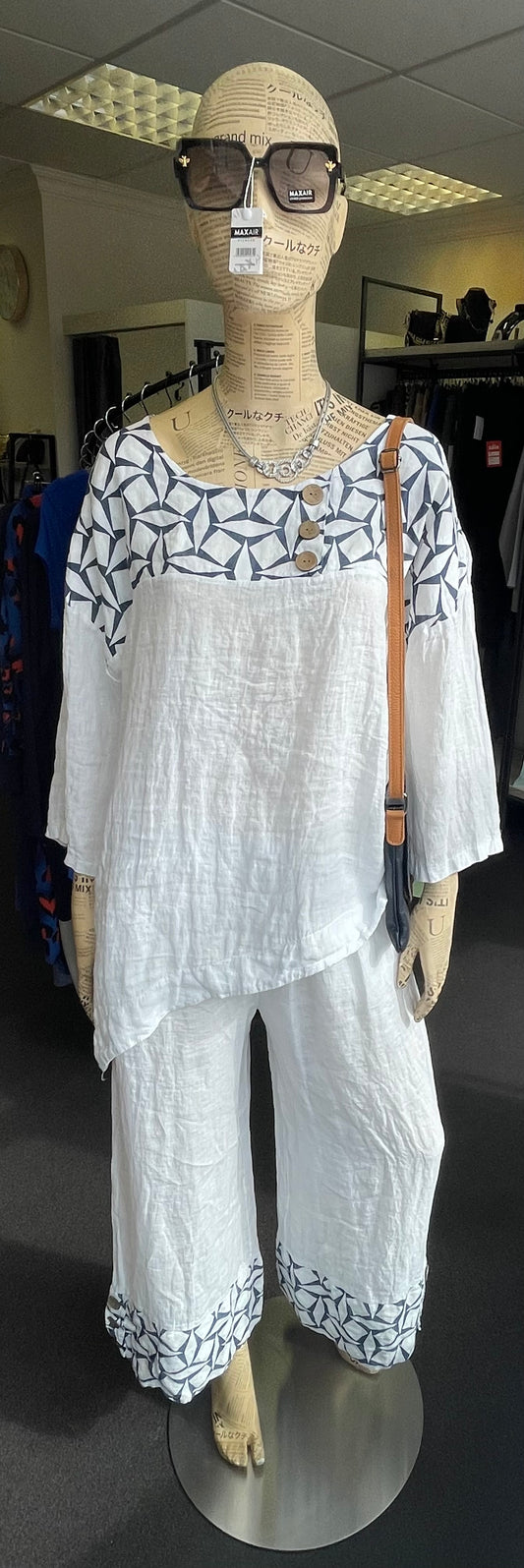 Sarah Tempest asymmetrical linen top with geometric print and coco buttons