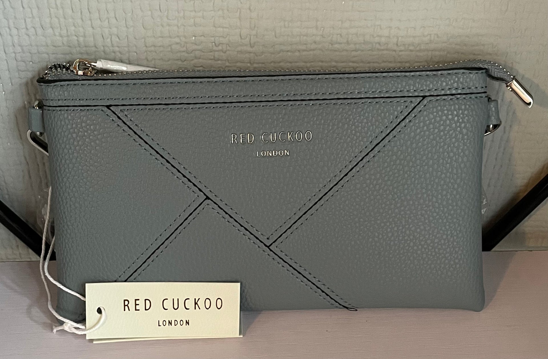 Red cuckoo clutch bags clearance
